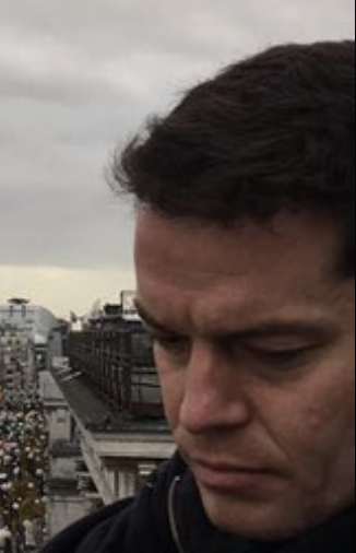 Tim Sanders carrying out a building diagnostics survey on a London rooftop